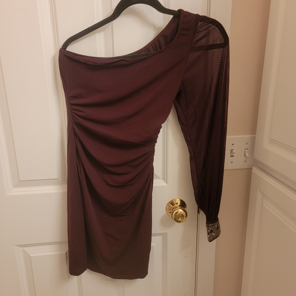 One shoulder form fitting mini dress.